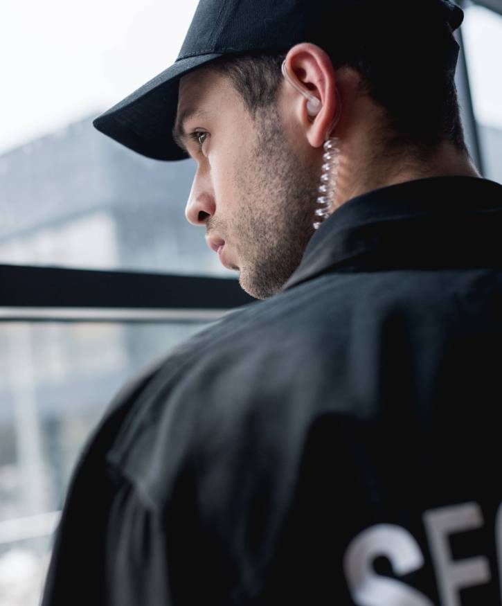 handsome-guard-in-black-uniform-with-earphone-look-2026-01-05-23-40-06-utc